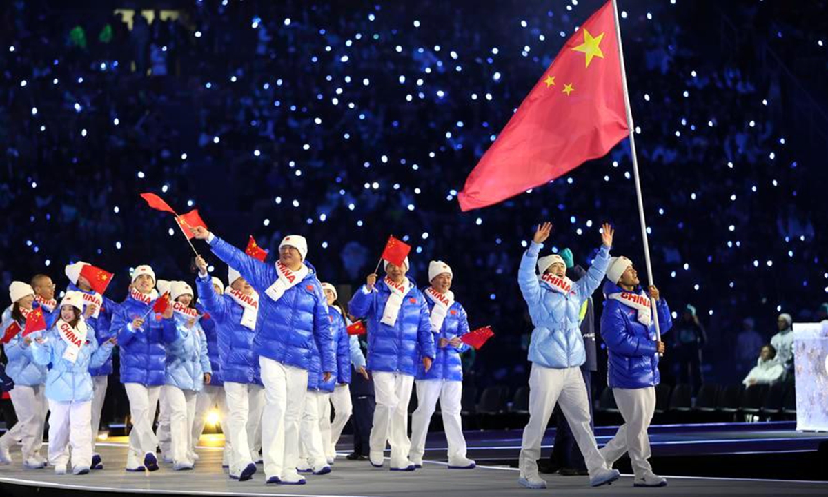 The delegation of the People's Republic of China parades into the Predazzo Ski Jumping Stadium during the opening ceremony of the Milan-Cortina 2026 Olympic Winter Games in Predazzo, Italy, Feburary 6, 2026. Photo: Xinhua