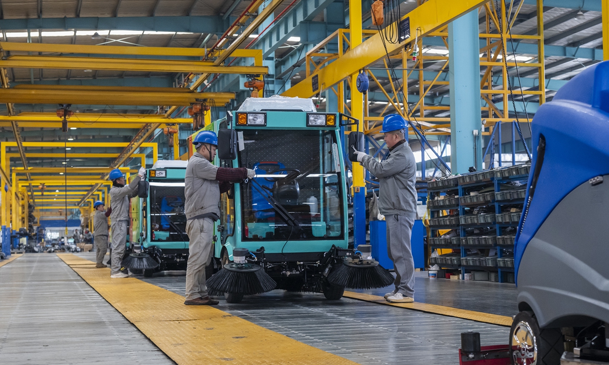 Workers assemble new-energy electric sweeper trucks at a new-energy company in Wuhu, East China's Anhui Province on February 10, 2026. As the Spring Festival approaches, local enterprises are mobilizing employees to operate at full capacity, accelerate output, and fulfill orders to meet market demand. Photo: VCG