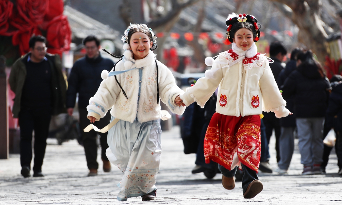 Children have fun on the Ming-Qing ancient street in Xiangcheng county, Xuchang of Central China's Henan Province, happily celebrating the Little New Year on February 10, 2026. Photo: IC