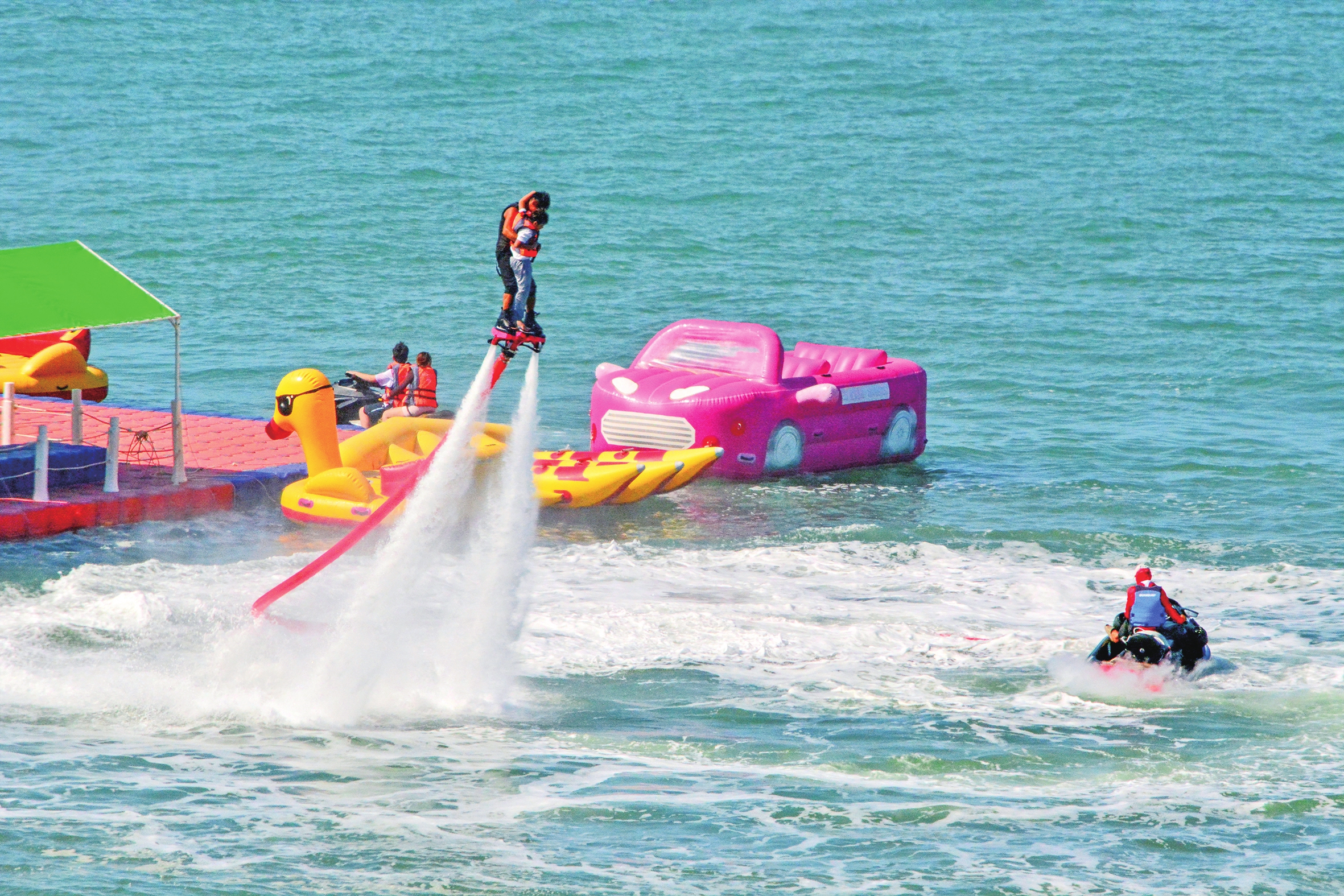 Tourists enjoy themselves on the sea in Sanya, South China's Hainan Province, on February 11, 2026. Photo: VCG