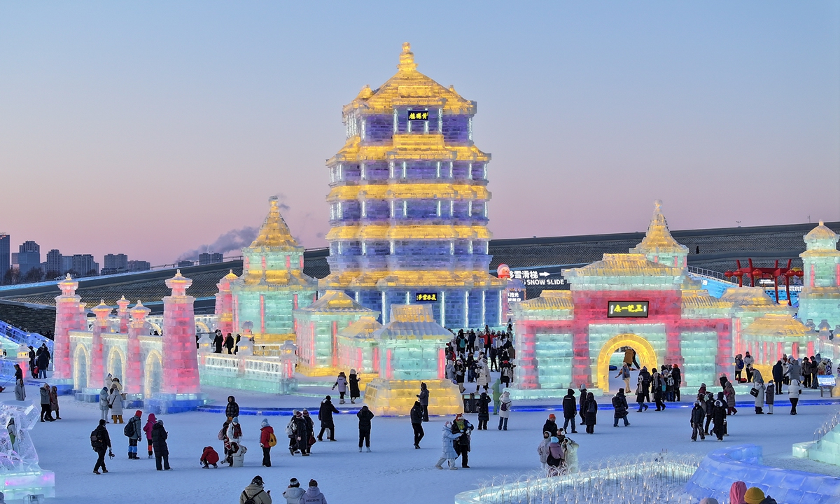 People enjoy themselves at Harbin Ice-Snow World. Photo: VCG