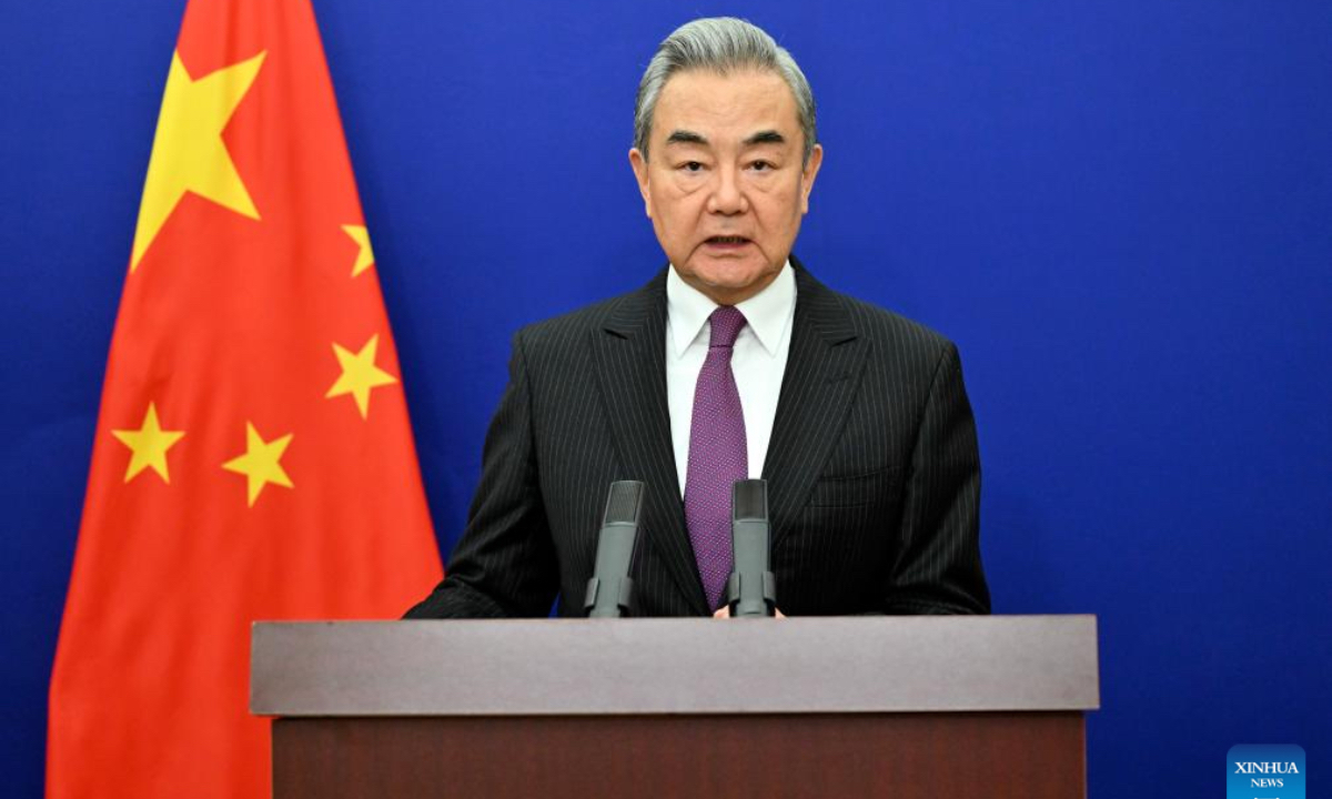 Chinese Foreign Minister Wang Yi, also a member of the Political Bureau of the Communist Party of China Central Committee, gives a speech via video link at the high-level segment of the 61st session of the United Nations Human Rights Council, in Beijing, capital of China, on Feb. 23, 2026. (Xinhua/Yin Bogu)