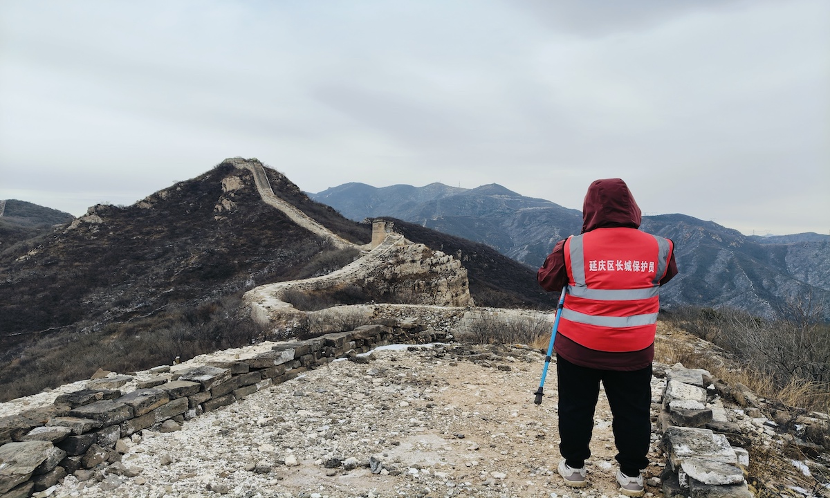 Liu Hongyan, a Great Wall protector in Shixia Village, conducts her daily patrol along the Great Wall in Yanqing District, Beijing. Photo: People’s Daily
