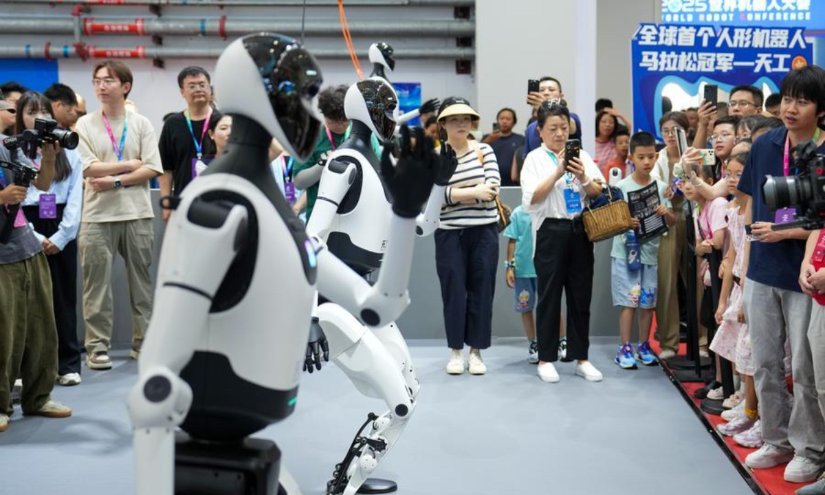 Humanoid robots perform at the 2025 World Robot Conference (WRC) in Beijing, capital of China, Aug. 11, 2025. (Xinhua/Ju Huanzong)