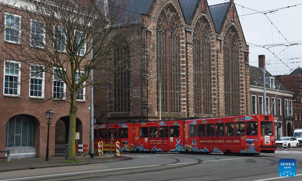 A tram decorated to celebrate the upcoming Chinese New Year is pictured in The Hague, the Netherlands, on Feb. 13, 2026. The tram has debuted on the busiest urban tram line in The Hague, bringing the festive spirit of the Chinese New Year to local residents. (Xinhua/Shao Haijun)

