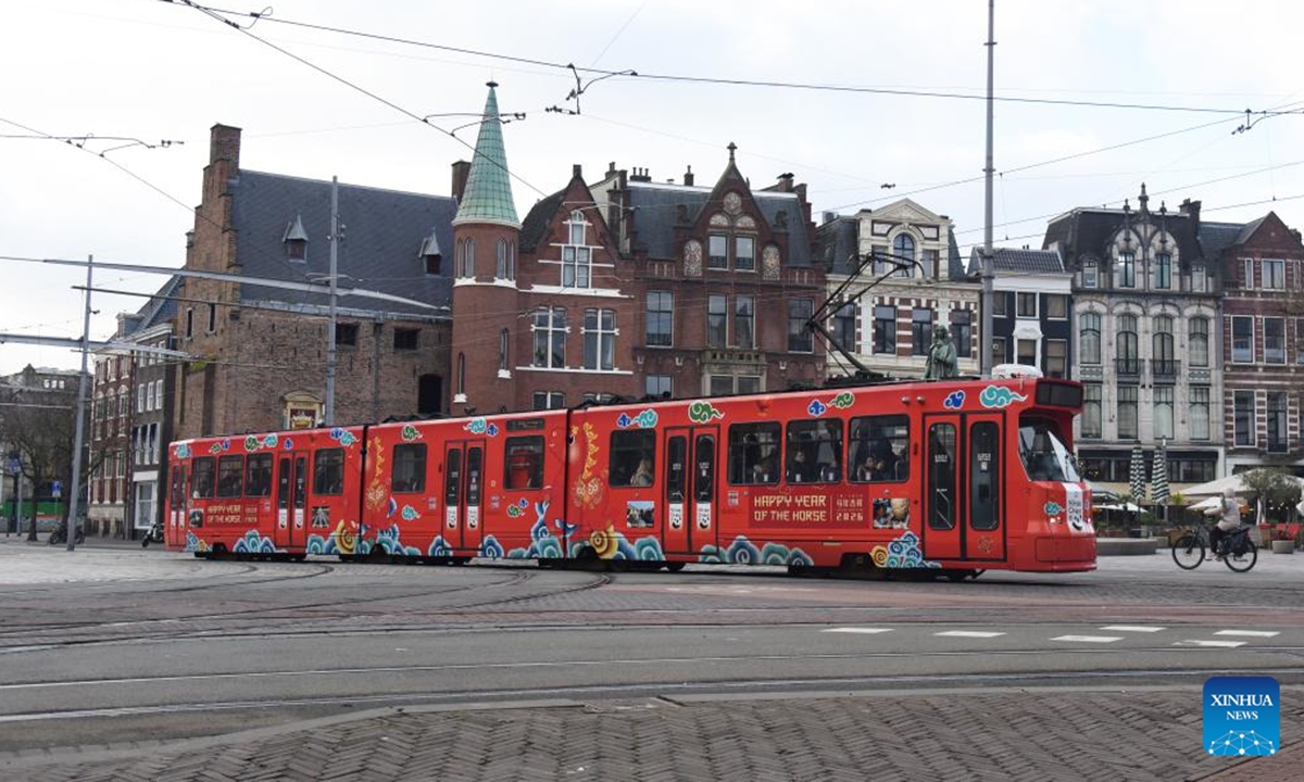 A tram decorated to celebrate the upcoming Chinese New Year is pictured in The Hague, the Netherlands, on Feb. 13, 2026. The tram has debuted on the busiest urban tram line in The Hague, bringing the festive spirit of the Chinese New Year to local residents. (Xinhua/Shao Haijun)

