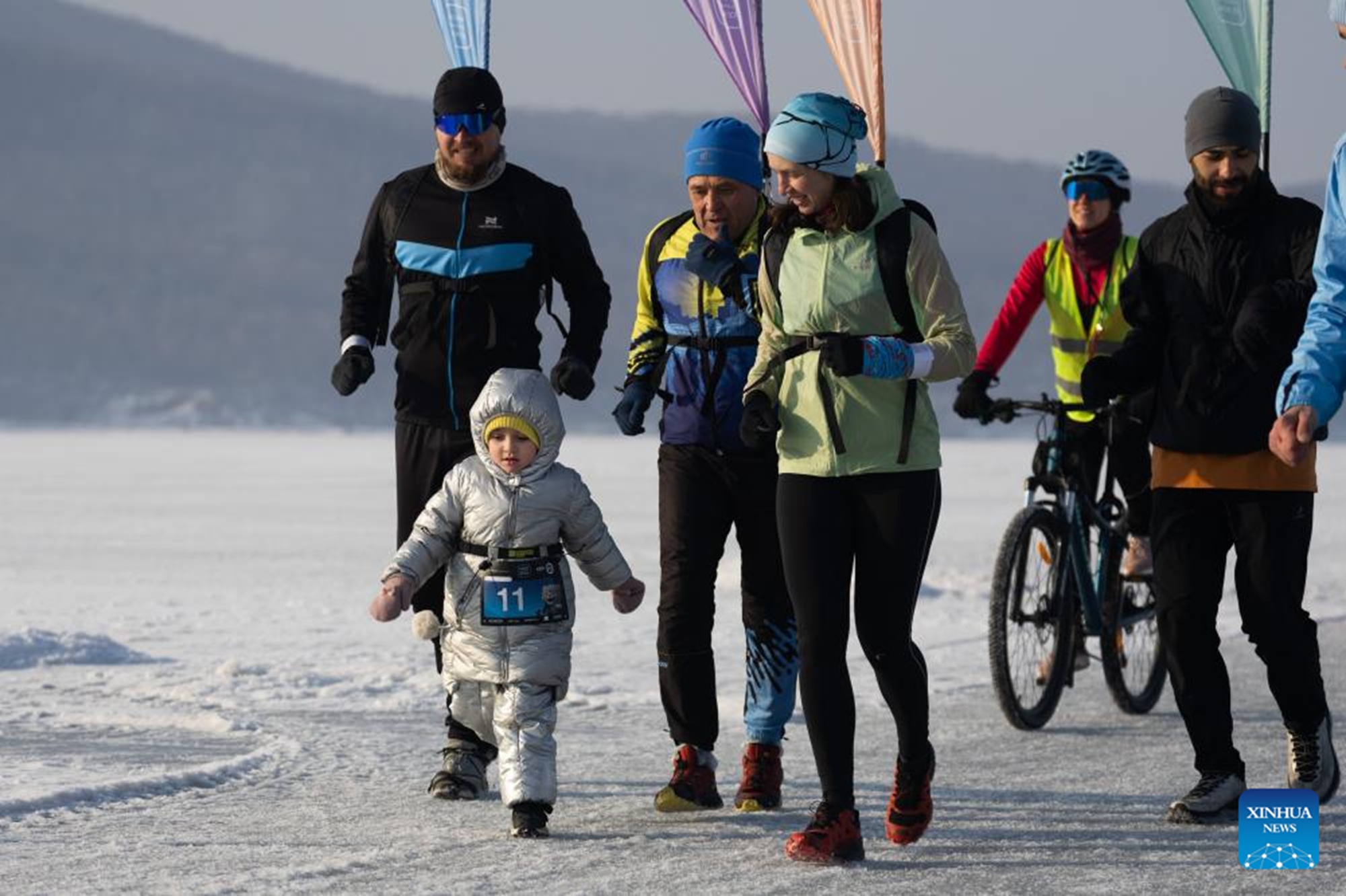 Participants take part in an ice half marathon held on the frozen sea in Vladivostok, Russia, Feb. 14, 2026. (Photo by Andrey Matveenko/Xinhua)

