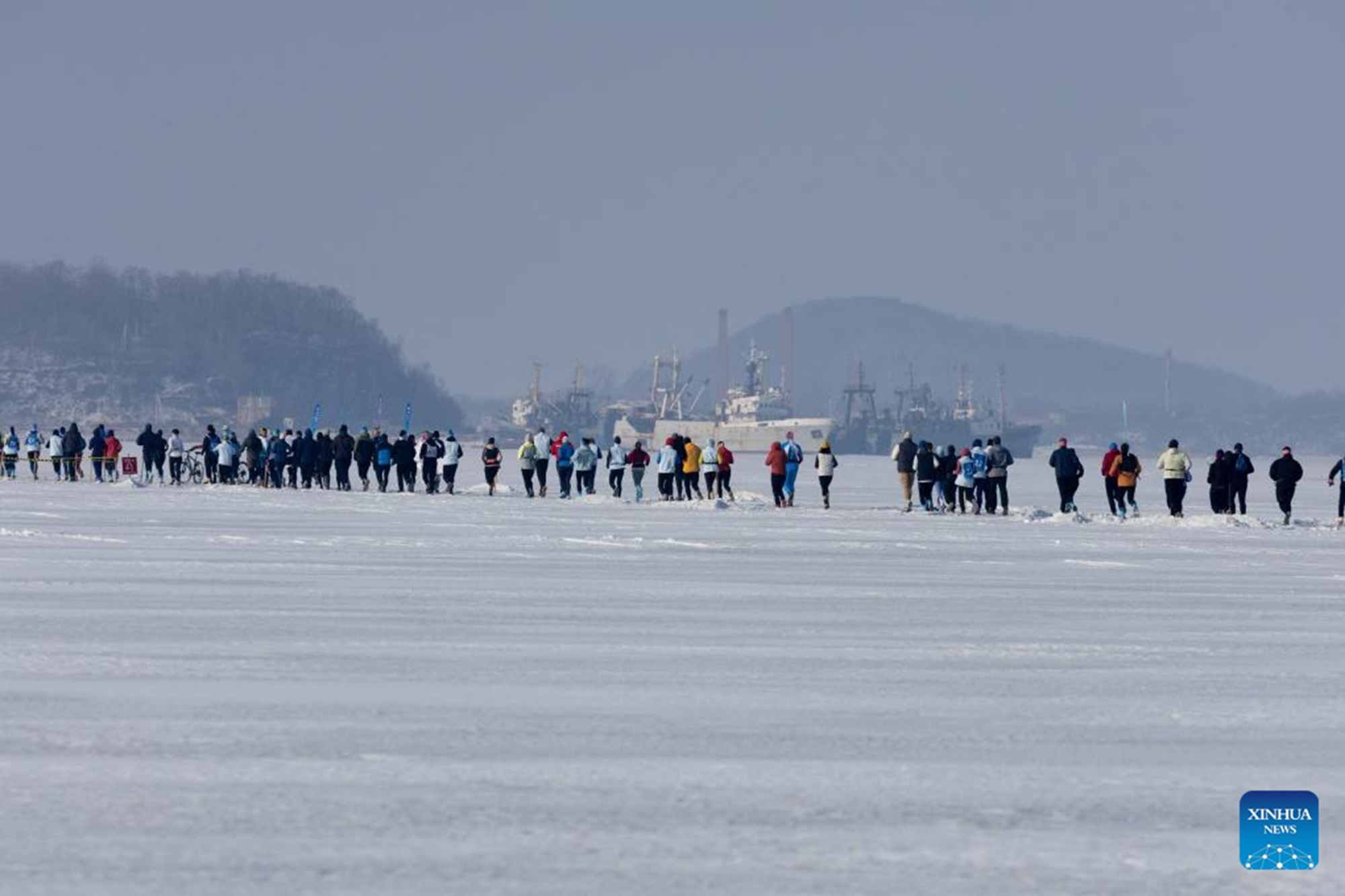 Participants take part in an ice half marathon held on the frozen sea in Vladivostok, Russia, Feb. 14, 2026. (Photo by Andrey Matveenko/Xinhua)

