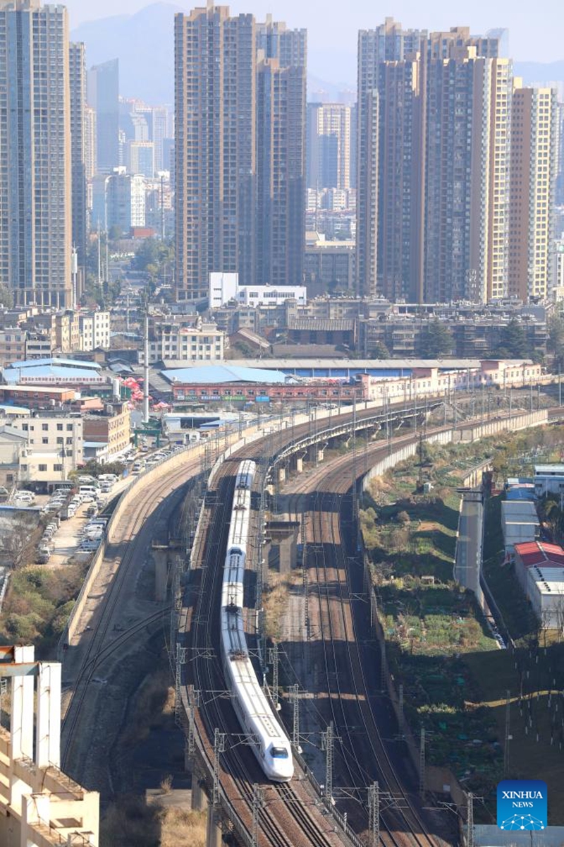 A bullet train runs in the city of Kunming, southwest China's Yunnan Province, Feb. 15, 2026. Over 285 million inter-regional passenger trips are predicted across China on Sunday, the first day of this year's nine-day Spring Festival holiday. Photo: Xinhua