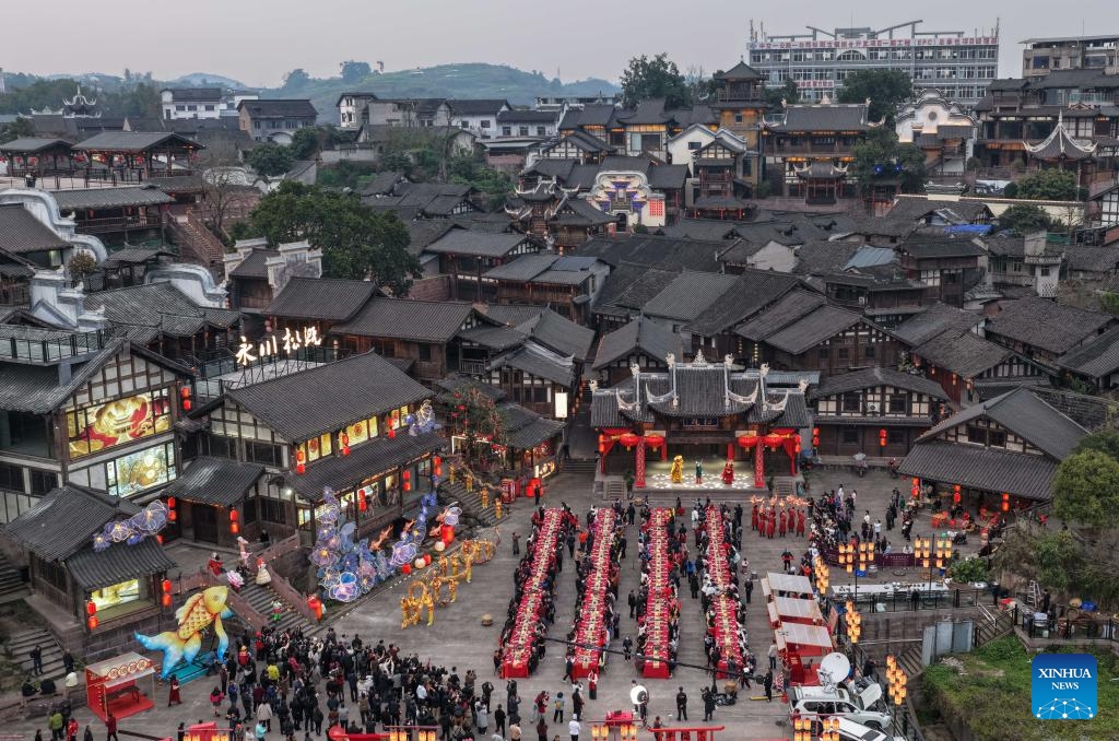 An aerial drone photo shows people enjoying a grand feast to mark the Chinese New Year's Eve in Songgai ancient town in southwest China's Chongqing, Feb. 16, 2026. Chinese New Year's Eve is the most significant moment of Spring Festival celebrations when families and friends sit around the table to share delicious food and personal stories, and stay up to welcome the New Year. (Photo: Xinhua)