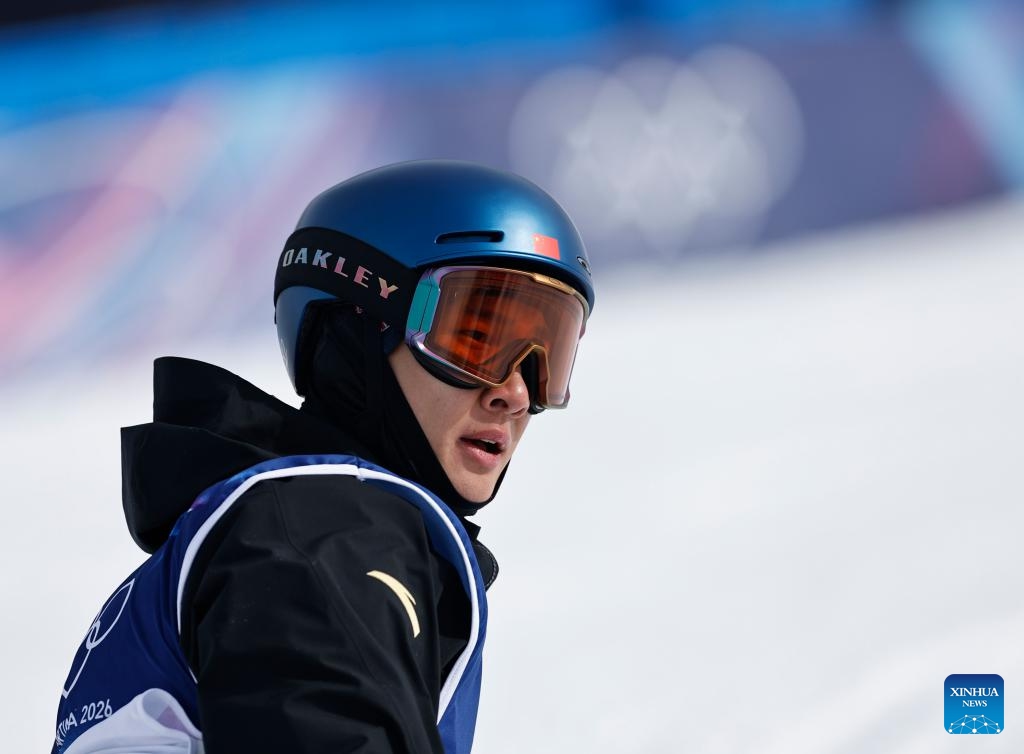 Su Yiming of China reacts during the snowboard men's snowboard slopestyle final at the Milan-Cortina 2026 Olympic Winter Games in Livigno, Italy, Feb. 18, 2026. (Photo: Xinhua)
