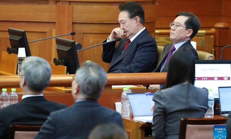 This file photo taken on Feb. 20, 2025 shows Yoon Suk-yeol (C) attending a hearing of his impeachment trial at the constitutional court in Seoul, South Korea. South Korea's former President Yoon Suk-yeol was sentenced to life in prison on charges of insurrection stemming from his declaration of emergency martial law, live footage showed Thursday. (Xinhua/Yao Qilin)