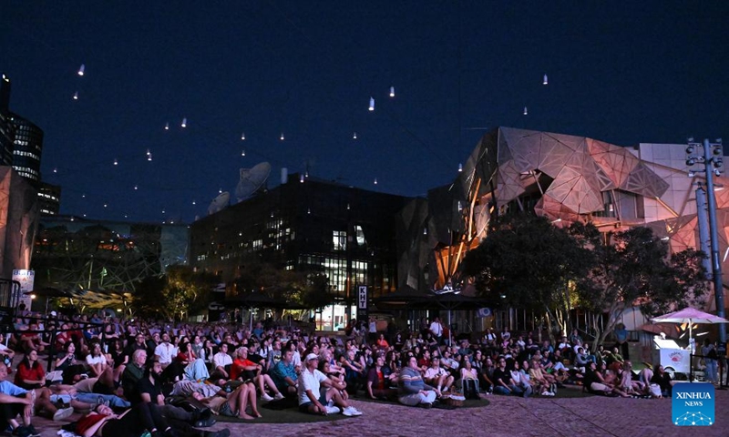 Audiences watch The Goddess, the 1934 classic Chinese silent movie, at the Federation Square in Melbourne, Australia, on Feb. 20, 2026. This is the last silent movie shown here from Feb. 16 to 20. (Xinhua/Xu Haijing)