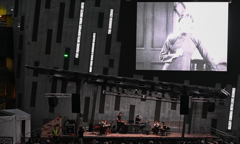 Audiences watch The Goddess, the 1934 classic Chinese silent movie, at the Federation Square in Melbourne, Australia, on Feb. 20, 2026. This is the last silent movie shown here from Feb. 16 to 20. (Xinhua/Xu Haijing)