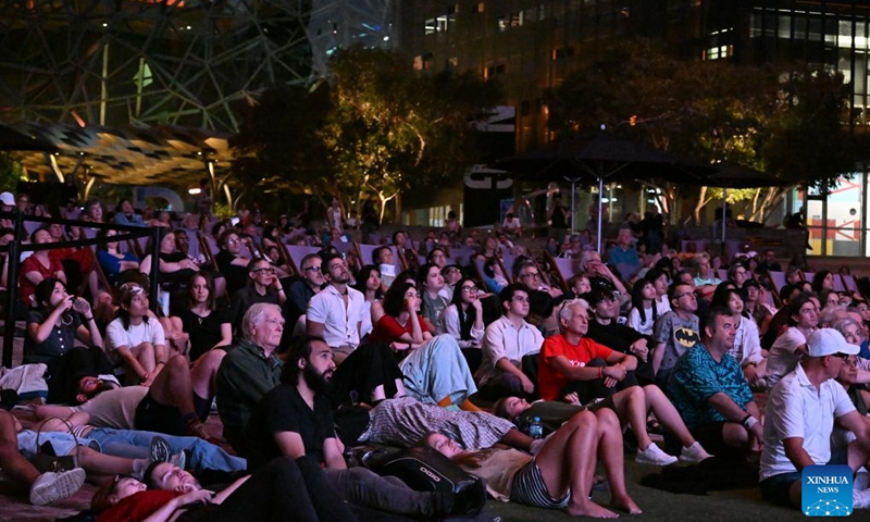 Audiences watch The Goddess, the 1934 classic Chinese silent movie, at the Federation Square in Melbourne, Australia, on Feb. 20, 2026. This is the last silent movie shown here from Feb. 16 to 20. (Xinhua/Xu Haijing)