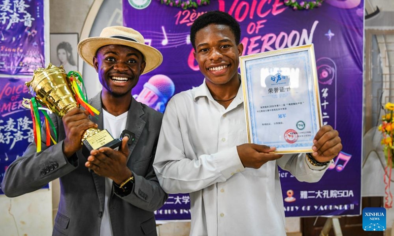 Winners of the 12th edition of the Voice of Cameroon Chinese song competition pose with their trophies and certificates at the University of Yaounde II in Soa, Cameroon, Feb. 20, 2026. (Xinhua/Kepseu)