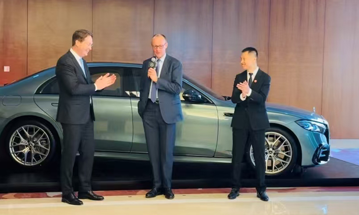 German Chancellor Friedrich Merz (center) comments on his test ride experience on a Mercedes-Benz S-Class car with Urban and Highway Navigation System, jointly developed by Mercedes-Benz and Chinese tech company Momenta in Beijing, during Merz's official visit to China, on February 26, 2026. Photo: Chi Jingyi/GT