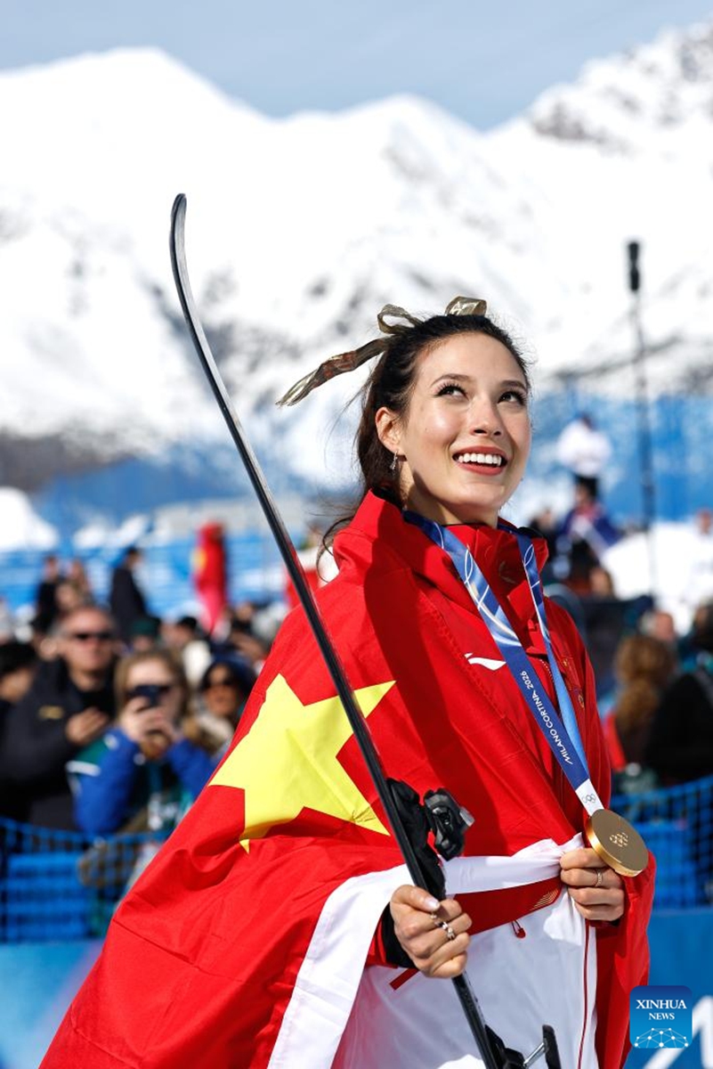 Gold medalist Gu Ailing of China reacts after the awarding ceremony for freestyle skiing women's freeski halfpipe at the Milan-Cortina 2026 Olympic Winter Games in Livigno, Italy, Feb. 22, 2026. (Xinhua/Wang Peng)