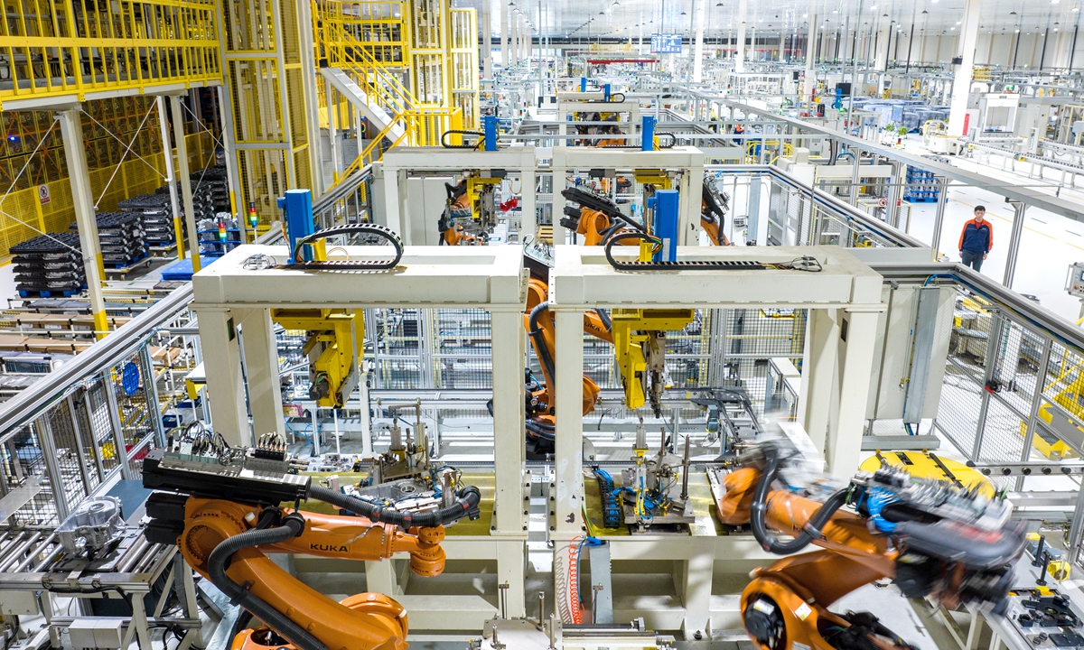 Robotic arms operate at high speed on the production line, with technicians rushing to complete orders for dual-clutch automatic transmissions at a plant in Changxing, East China's Zhejiang Province on February 23, 2026. Workers are back at the company after the Chinese Lunar New Year, with all production lines running at full capacity. Photo: VCG