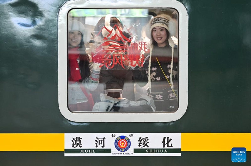 Passengers board a train at Harbin Railway Station in Harbin, northeast China's Heilongjiang Province, Feb. 22, 2026. (Photo by Yuan Yong/Xinhua)