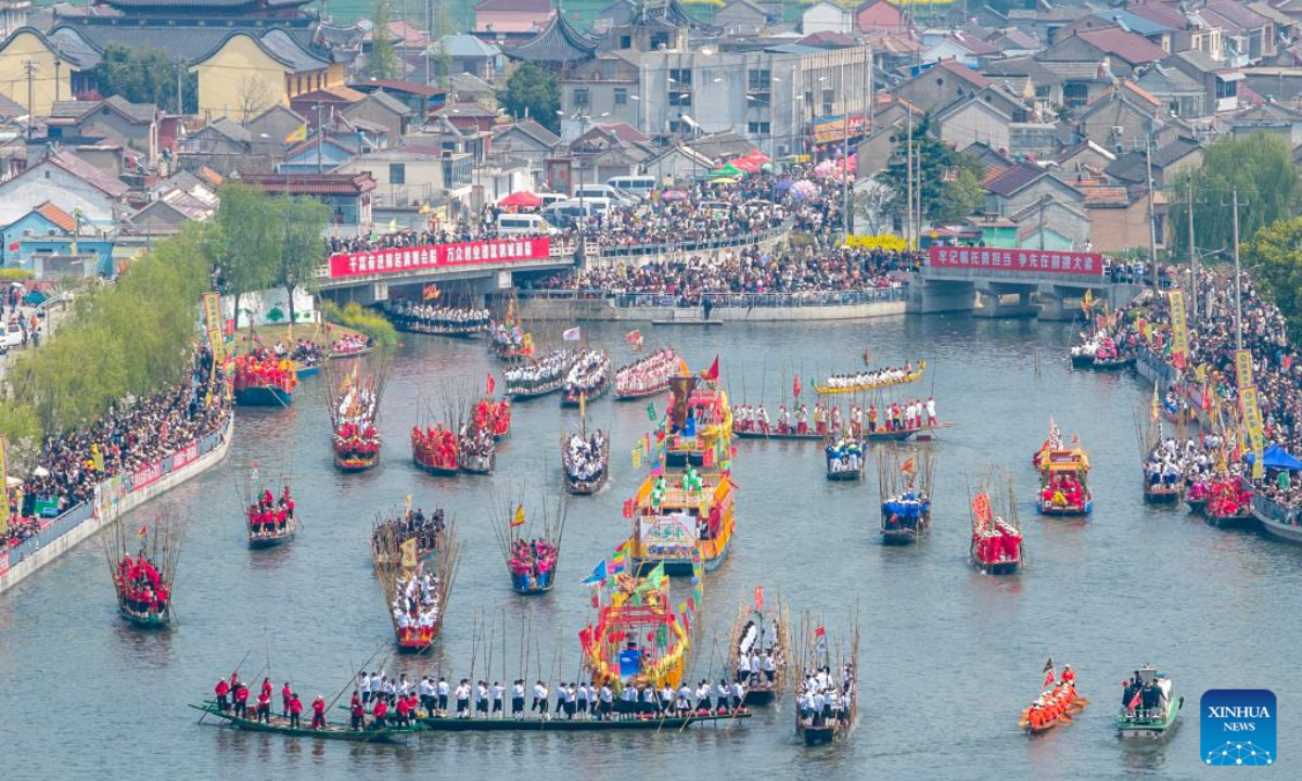 An aerial drone photo taken on April 5, 2026 shows boats sailing during the Maoshan boat fair in Xinghua City, east China's Jiangsu Province. The annual Maoshan boat fair in Xinghua was held on Sunday. The event was listed as a national intangible cultural heritage in 2014. (Photo by Shi Daozhi/Xinhua)