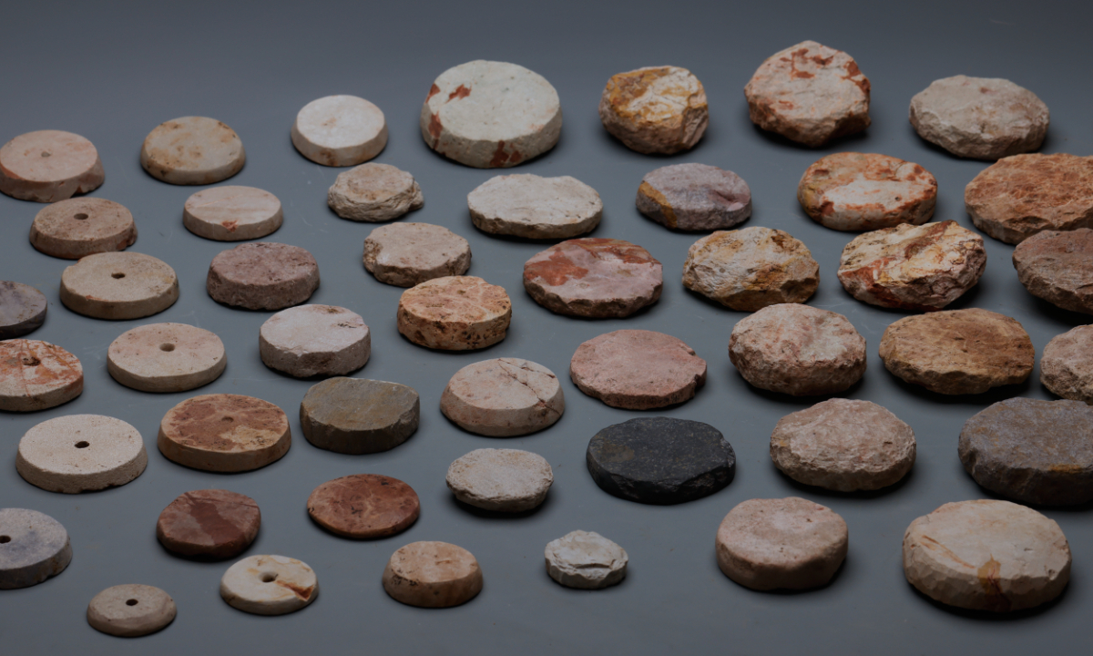 Stone spindle whorls unearthed from the oushan site in Wuxi, East China's Jiangsu Province, a Neolithic settlement located between the Yangtze River and Taihu Lake Photo: Courtesy of the Jiangsu Provincial Institute of Cultural Relics and Archaeology