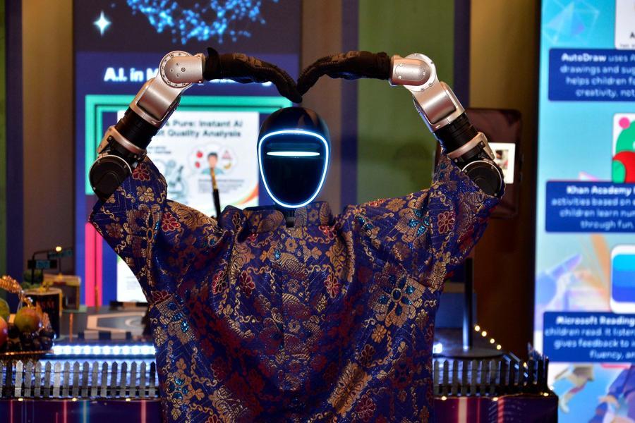 A humanoid robot from China gestures at Brunei's traditional Hari Raya celebration in Bandar Seri Begawan, Brunei, on April 4, 2026. (Photo by Samle Bin Haji Jahit/Xinhua)
