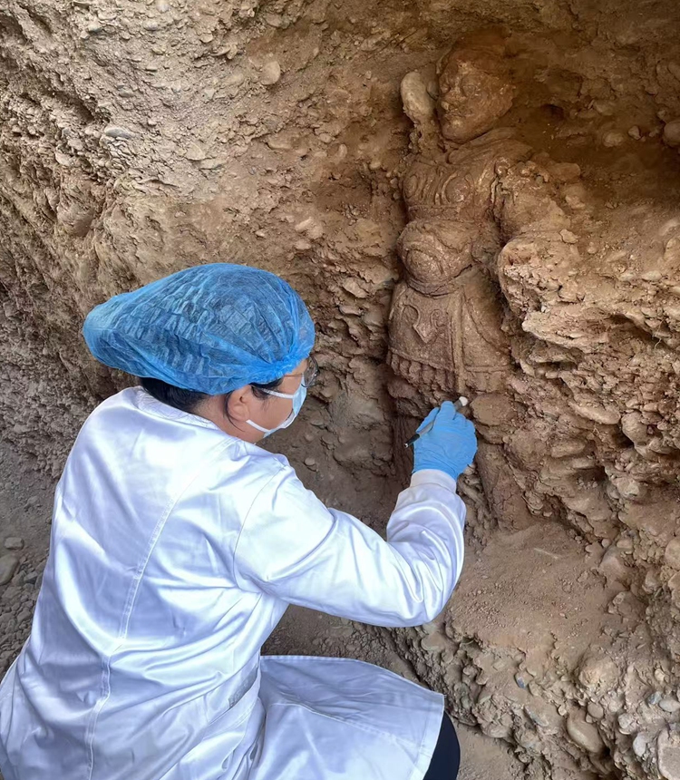 An archaeologist carries out restoration work at the Youyi Road tomb cluster. Photo: Courtesy of Xinjiang Institute of Cultural Relics and Archaeology
