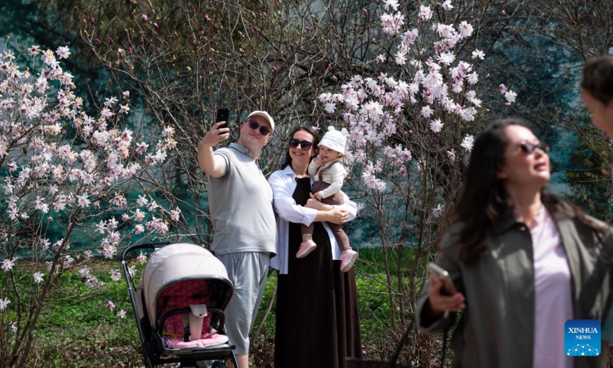 People enjoy their leisure time at a botanical garden in Almaty, Kazakhstan, April 4, 2026. (Xinhua/Li Renzi)