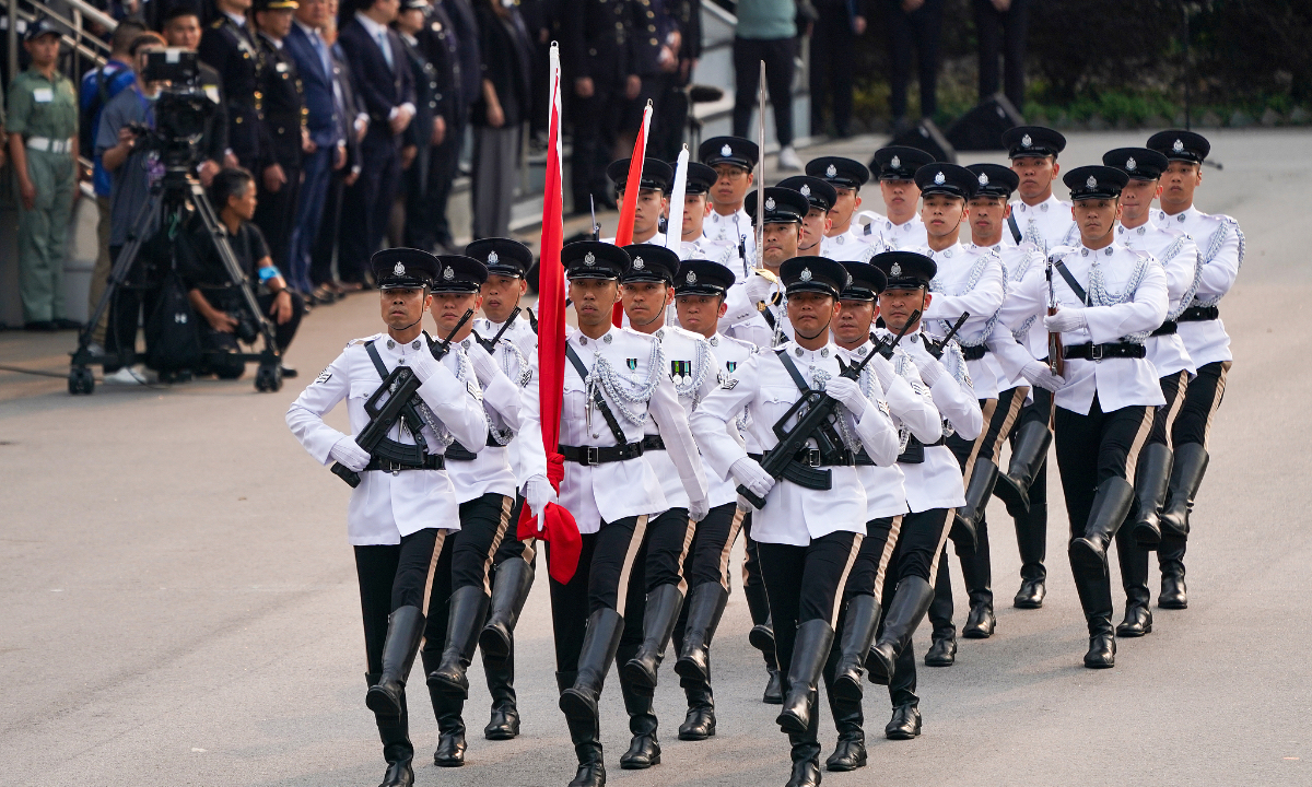 April 15, 2026 marks the 11th National Security Education Day for All. The Security Bureau of the Hong Kong Special Administrative Region Government, together with its disciplined services, held a flag-raising ceremony at the Hong Kong Police College. The image shows the flag escort formation entering the venue. Photo: VCG