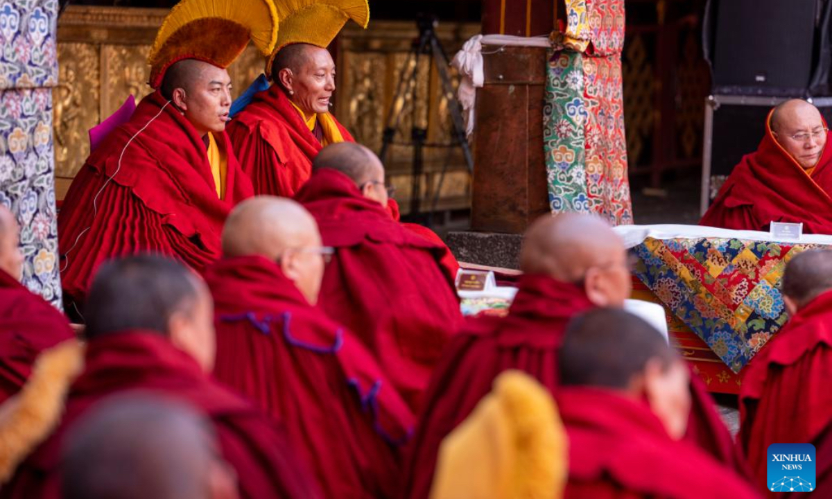 Monks attend a sutra debate and award ceremony conferring the title of Geshe Lharampa at the Jokhang Temple in Lhasa, southwest China's Xizang Autonomous Region, April 5, 2026. Thirteen monks obtained the degree of Geshe Lharampa following a sutra debate on Sunday in southwest China's Xizang Autonomous Region. Geshe Lharampa is the highest degree in the exoteric teachings of the Gelug school of Tibetan Buddhism, equivalent to a doctoral degree in modern education. (Xinhua/Tenzing Nima Qadhup)