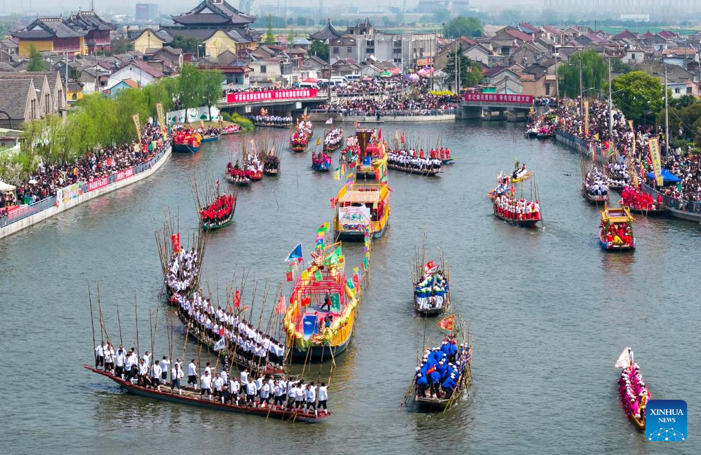 An aerial drone photo taken on April 5, 2026 shows boats sailing during the Maoshan boat fair in Xinghua City, east China's Jiangsu Province. The annual Maoshan boat fair in Xinghua was held on Sunday. The event was listed as a national intangible cultural heritage in 2014. (Photo by Shi Daozhi/Xinhua)