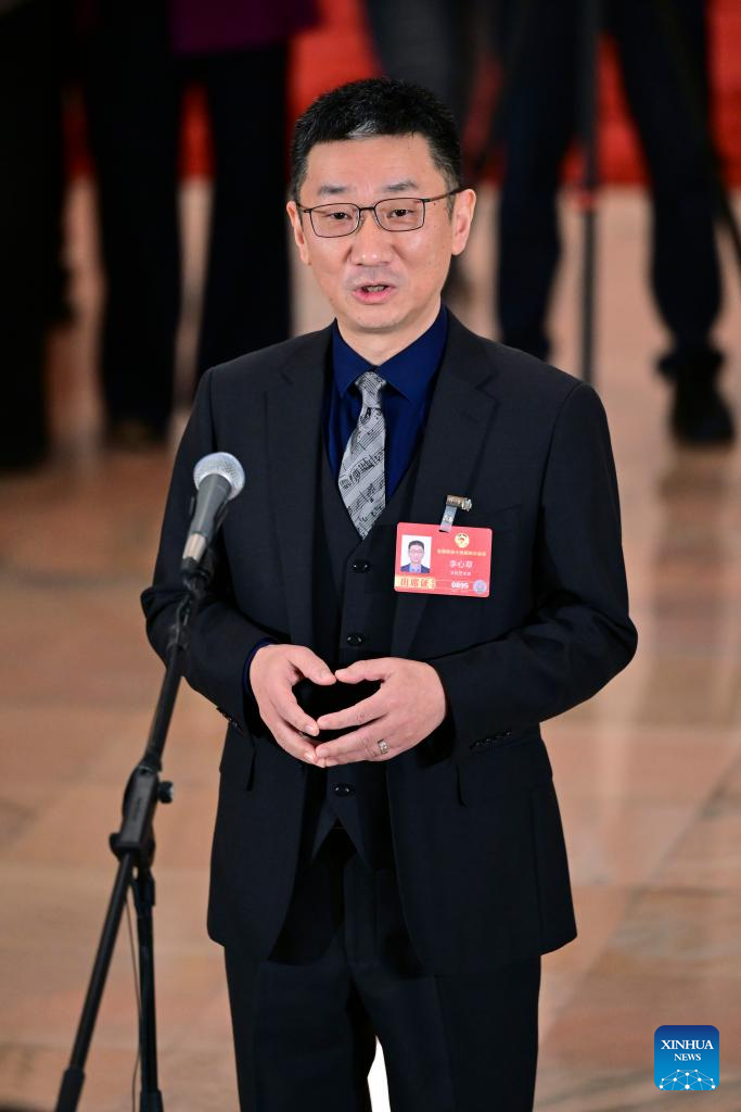 Li Xincao, a member of the 14th National Committee of the Chinese People's Political Consultative Conference (CPPCC), attends a group interview ahead of the closing meeting of the fourth session of the 14th CPPCC National Committee at the Great Hall of the People in Beijing, capital of China, March 11, 2026. (Xinhua/Chen Yehua)