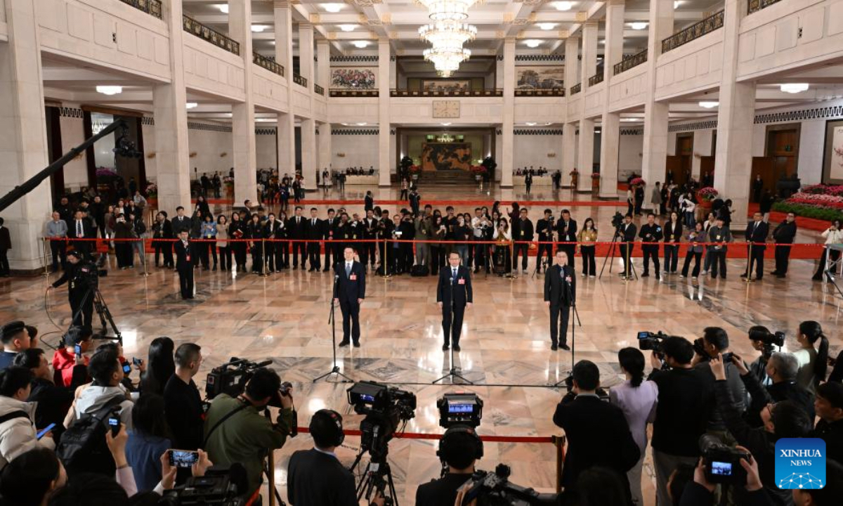 Members of the 14th National Committee of the Chinese People's Political Consultative Conference (CPPCC) attend a group interview ahead of the closing meeting of the fourth session of the 14th CPPCC National Committee at the Great Hall of the People in Beijing, capital of China, March 11, 2026. (Xinhua/Cao Yiming)