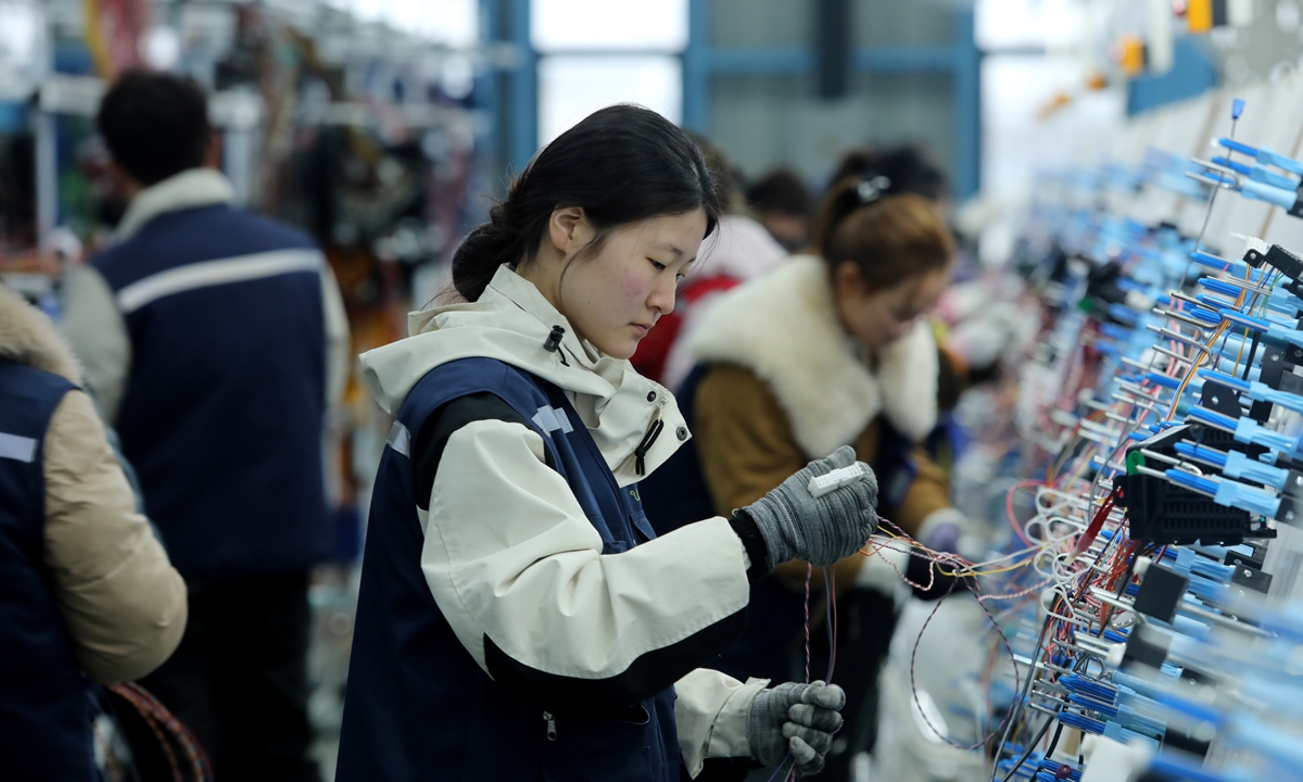 Workers rush to produce automotive wiring harnesses at Anhui Zhilian Automotive Wiring Harness Co in Mengcheng, East China's Anhui Province on February 26, 2026. At the beginning of spring, enterprises in the city have swiftly resumed production, with workers rushing to fulfill orders and expand markets, striving to achieve a good start in the first quarter and lay a solid foundation for high-quality development throughout the year. Photo: VCG