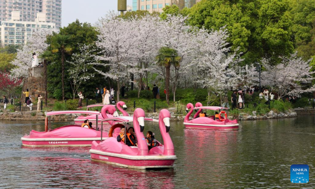 People take boats at a park during the Qingming Festival holiday in east China's Shanghai, April 4, 2026. (Xinhua/Chen Haoming)