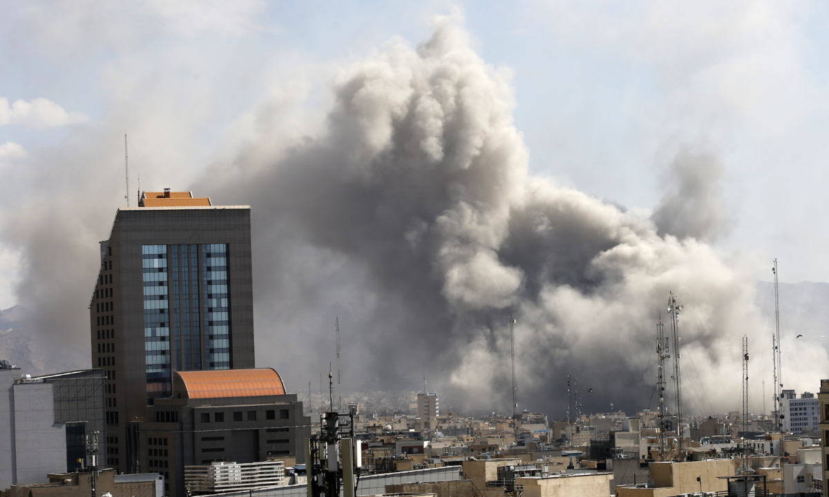 Plumes of smoke rise over the residential areas of the Iranian capital following airstrikes amid ongoing US-Israeli attacks as multiple explosions are heard across the city in Tehran, Iran, on March 01, 2026. Photo: VCG