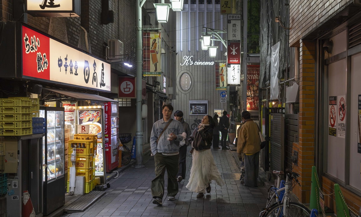 Pedestrians walk down a street in the amusement district of Shinjuku in Tokyo, on February 12, 2026. Photo: VCG