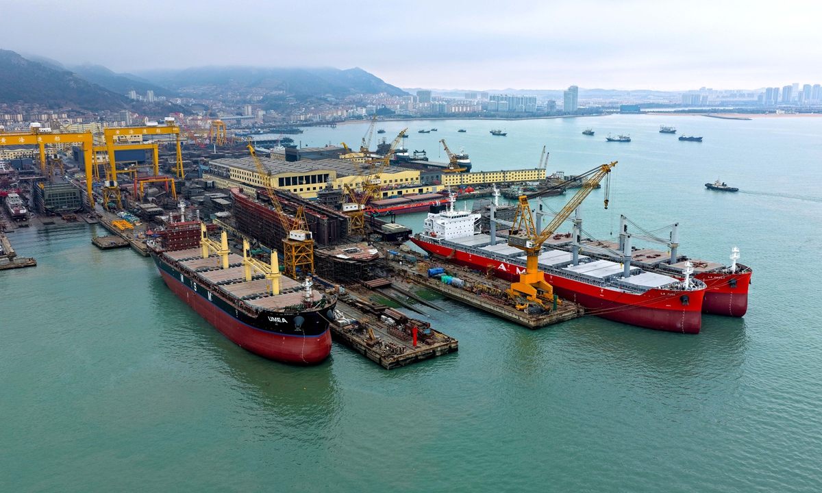 Workers are engaged in the construction and maintenance of large vessels at a shipbuilding and repair industrial base in Rongcheng, East China's Shandong Province, on February 24, 2026. 