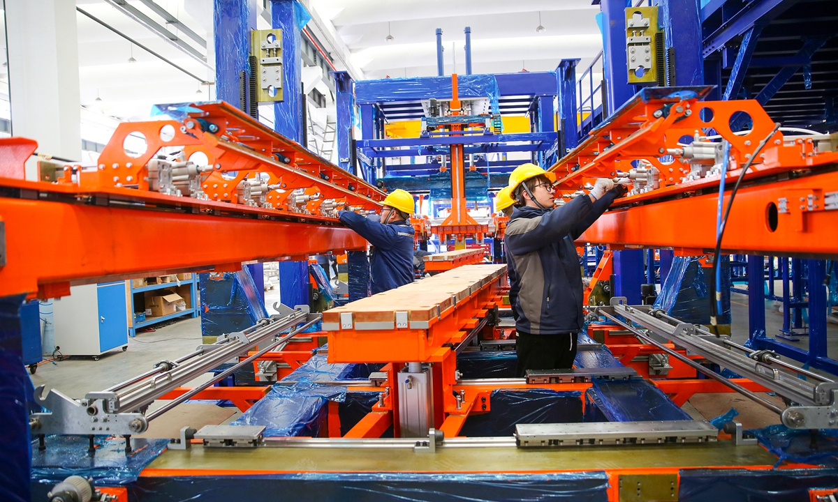Technicians debug a large and complex carpet production line designated for export to Europe in Nantong, Jiangsu Province, on February 25, 2026. 