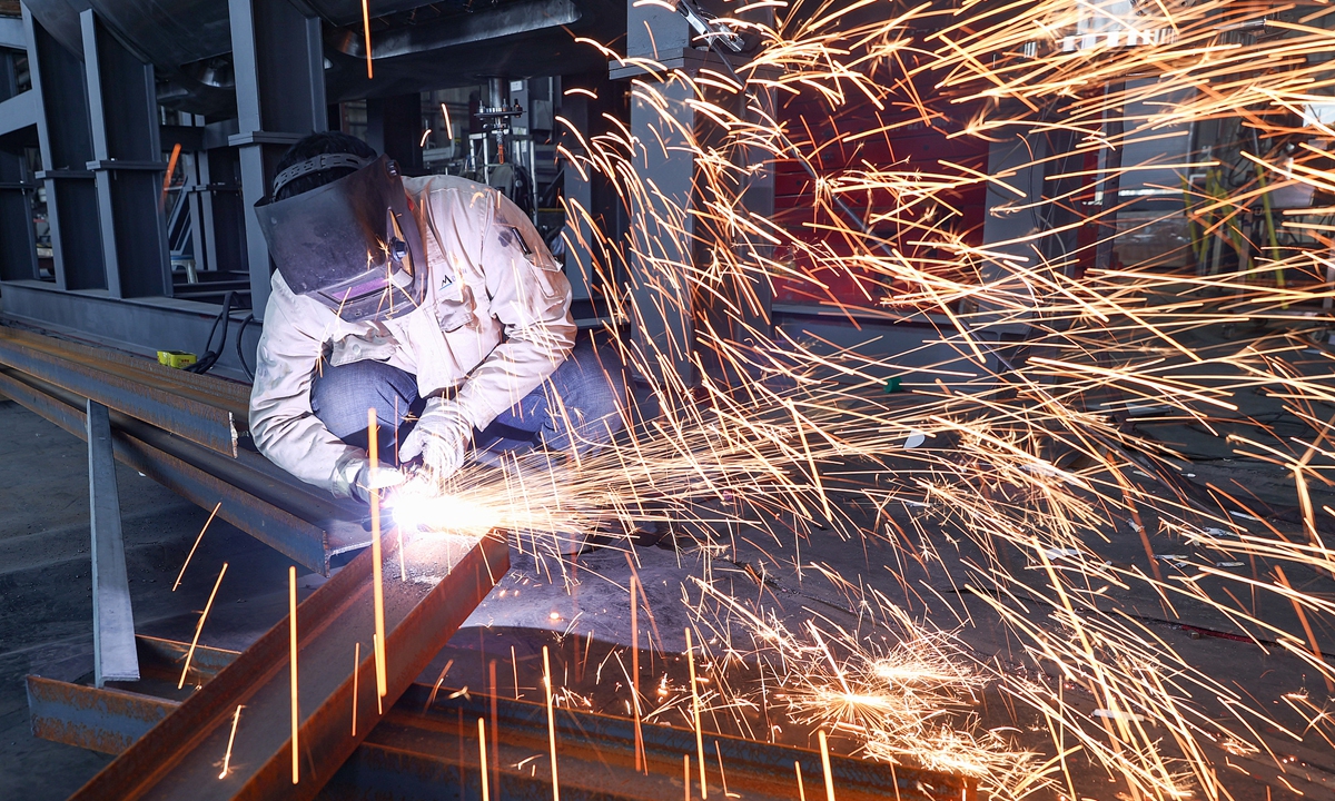 A worker performs cutting tasks in the assembly workshop of a bioreactor manufacturing enterprise to meet production orders in Lianyungang, Jiangsu Province, on February 25, 2026.