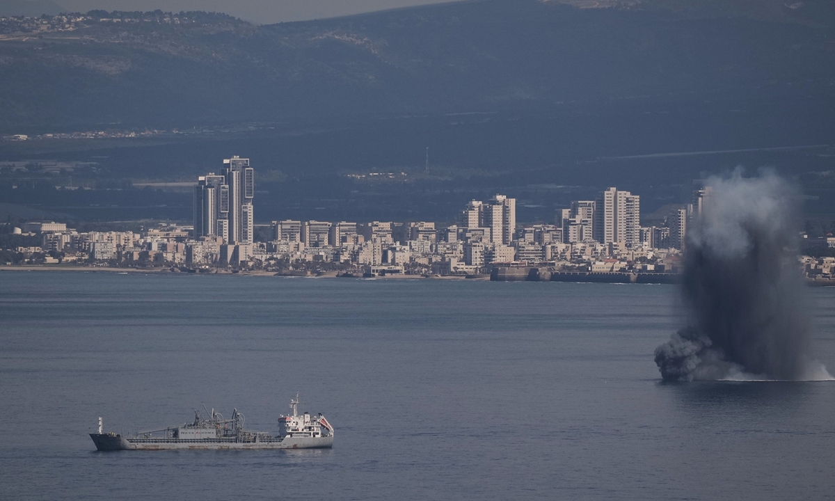An incoming projectile explodes over the water as Israel issues a nationwide alert following its strikes on Iran, in Haifa Bay, northern Israel, Saturday, February 28, 2026. (AP Photo/Leo Correa). Photo: VCG