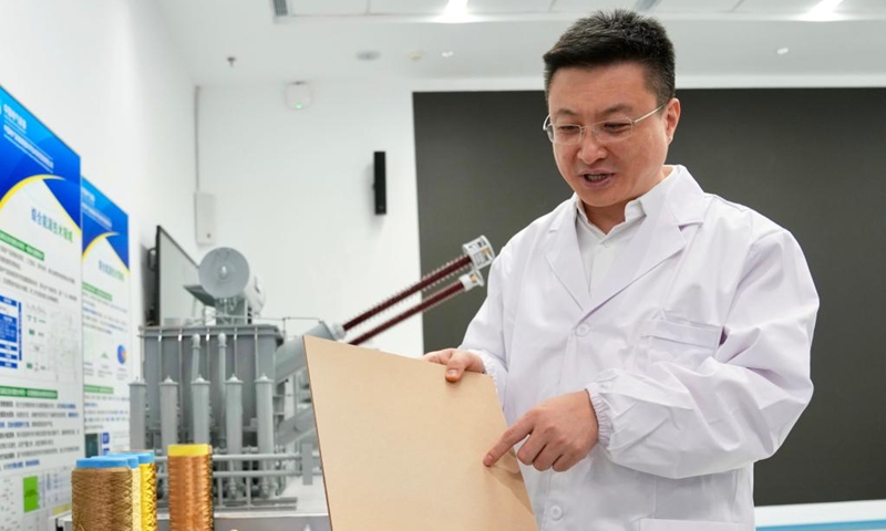 Zhang Fan introduces insulating cardboard, a key material for ultra-high voltage transformers, at a research base of China Electrical Equipment Group in Shanghai, east China, Jan. 27, 2026. Photo: Xinhua