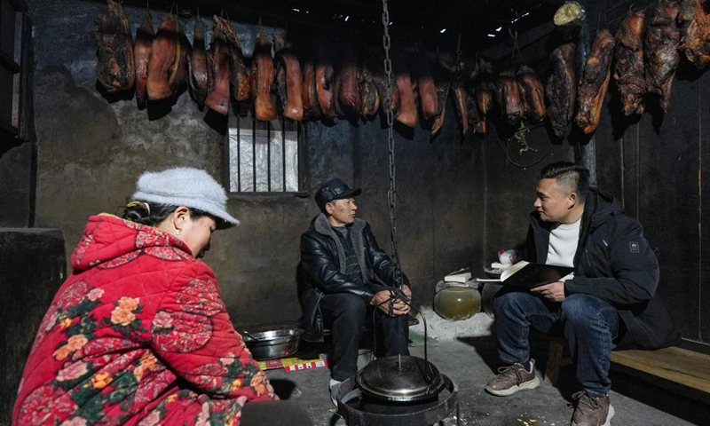 Zheng Wangchun (1st R) talks with villagers in Gulu Village of Hanyuan County, southwest China's Sichuan Province, Jan. 28, 2026. Photo: Xinhua
