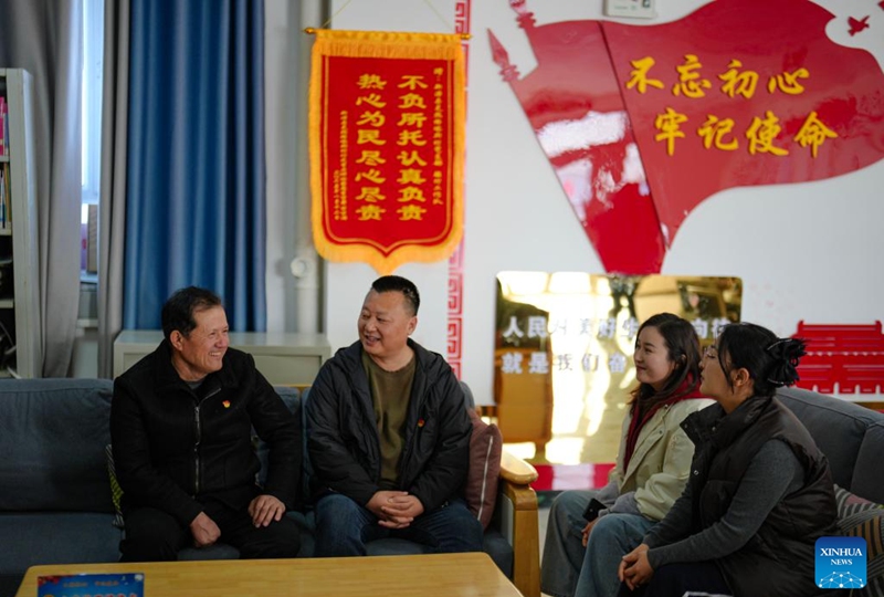 Musajan Khairat (1st L) communicates with local cadres at the community service center in Keregetas Village, Xinyuan County of Ili Kazak Autonomous Prefecture, northwest China's Xinjiang Uygur Autonomous Region, Feb. 9, 2026. Photo: Xinhua