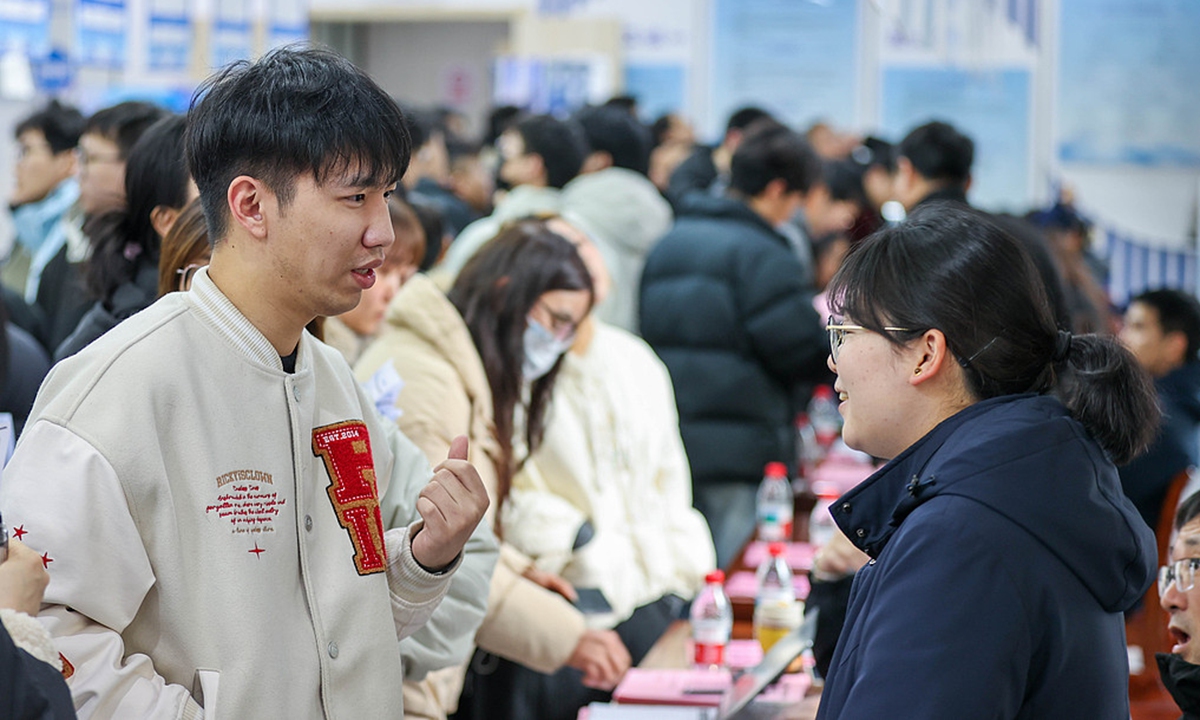 Job seekers review recruitment information at a job fair in Huzhou, East China's Zhejiang Province, on March 2, 2026. Photo: VCG