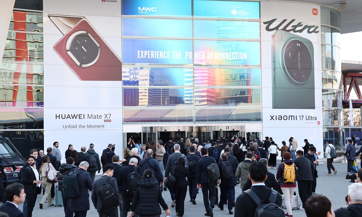Visitors to the Mobile World Congress (MWC) go to the entrance on March 2, 2026. The global mobile communications industry showcases its latest products and services at the MCW in Barcelona, Spain. Photo: VCG