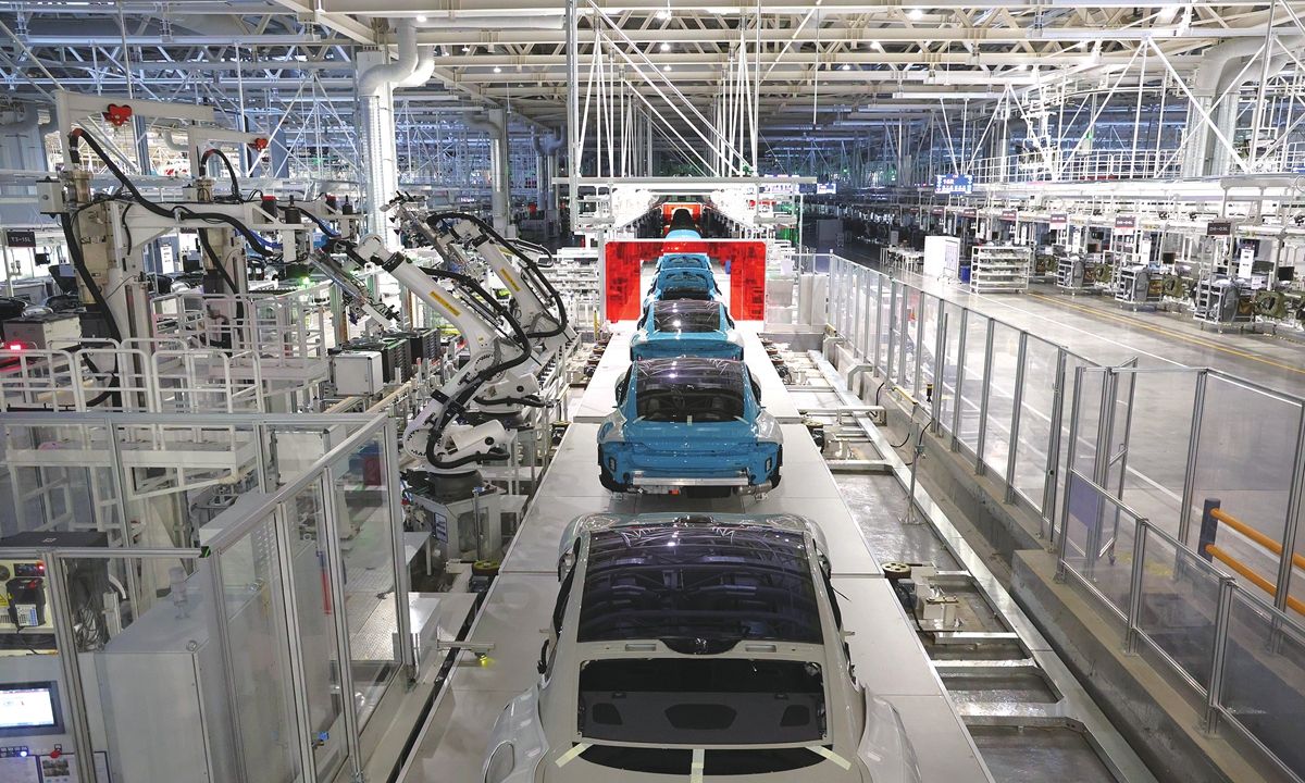Vehicles move through the automated assembly process at Xiaomi's final assembly workshop. Photo: Courtesy of Xiaomi