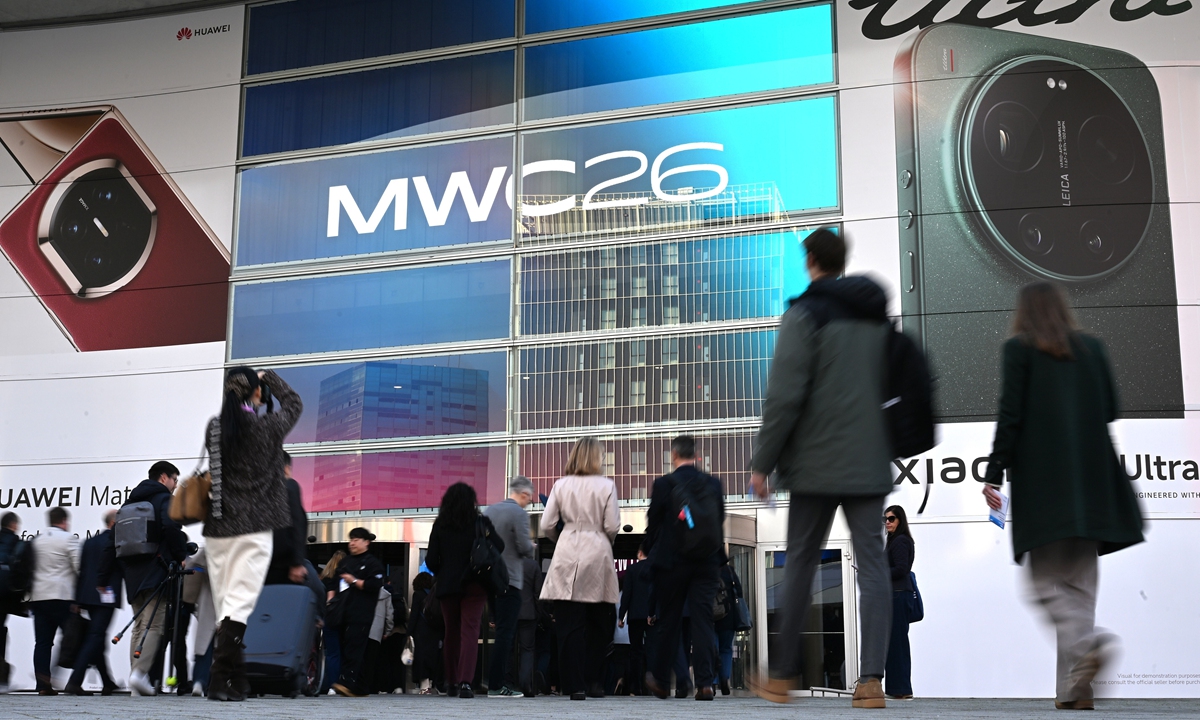 Visitors to the Mobile World Congress (MWC) go to the entrance on March 2, 2026. The global mobile communications industry showcases its latest products and services at the MCW in Barcelona, Spain. Photo: VCG