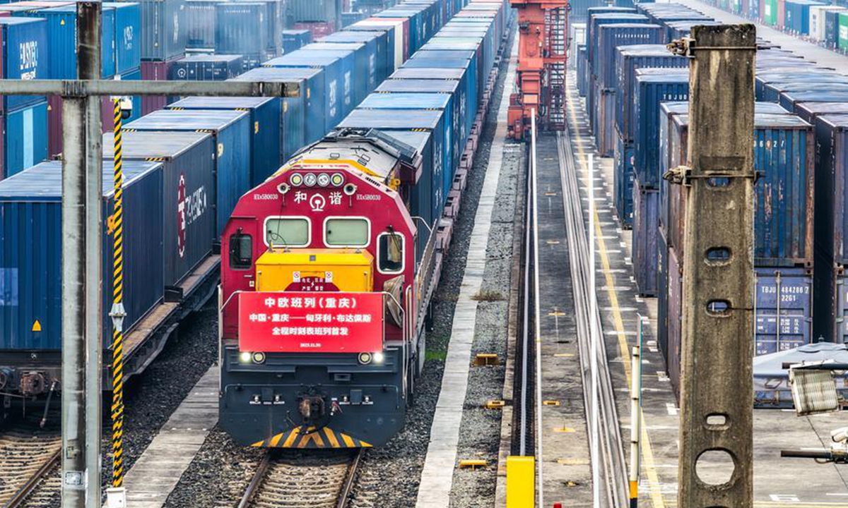 A drone photo shows a China-Europe freight train bound for Budapest, Hungary before departure at Tuanjiecun Station in Chongqing, southwest China, Nov. 30, 2025. (Xinhua/Tang Yi)